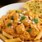 A realistic amateur style picture of 30-Minute Cowboy Butter Chicken Pasta taken by a phone camera