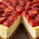 A realistic amateur style picture of Classic Strawberry Cheesecake with Fresh Strawberry Topping taken by a phone camera