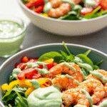 A realistic amateur style picture of Summer Grilled Shrimp Bowls with Creamy Cilantro Sauce taken by a phone camera